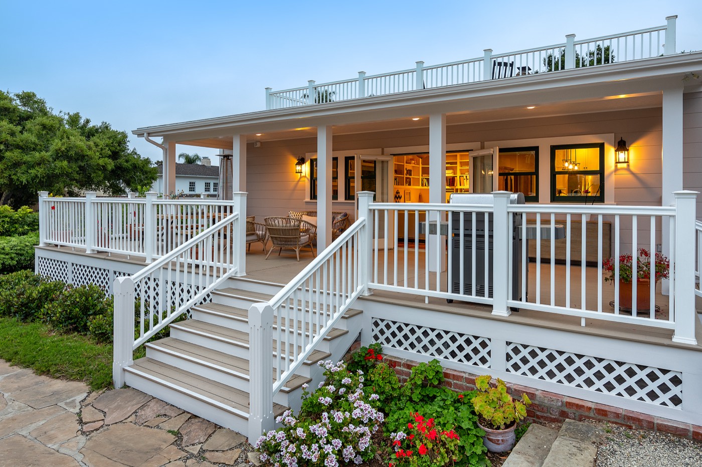 Wraparound porch and deck at dusk